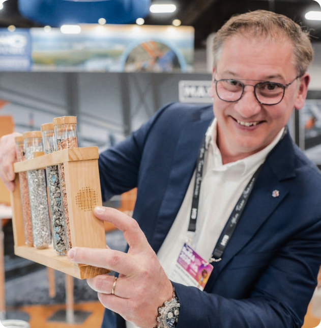 An attendee displaying recycled materials at the ReMA Show.
