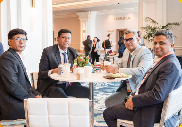 International ReMA attendees meeting around a table.