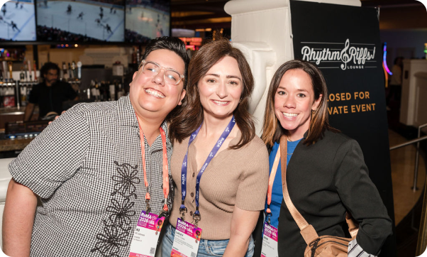 Three attendees connecting at the ReMA Show.