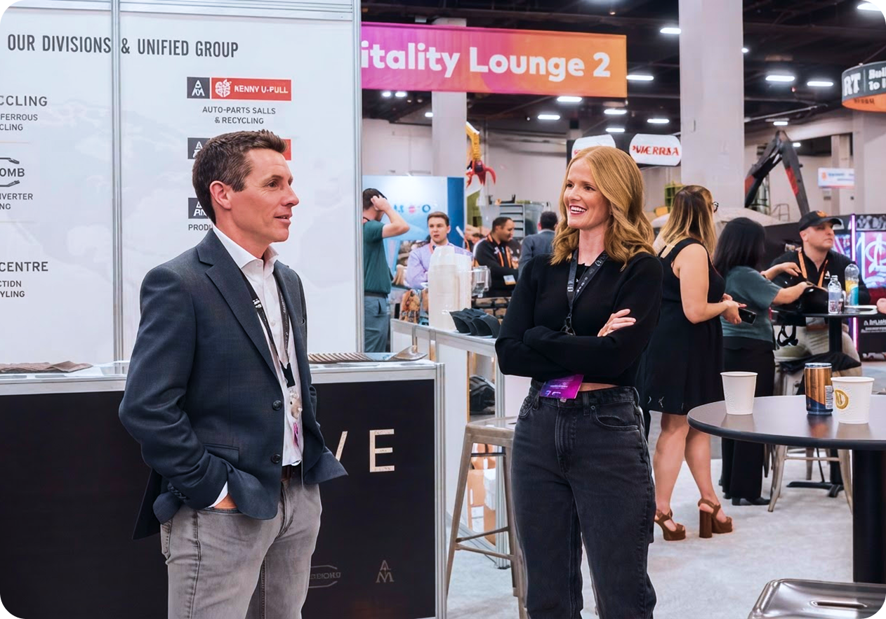 Industry partners talk together on the exhibition floor.